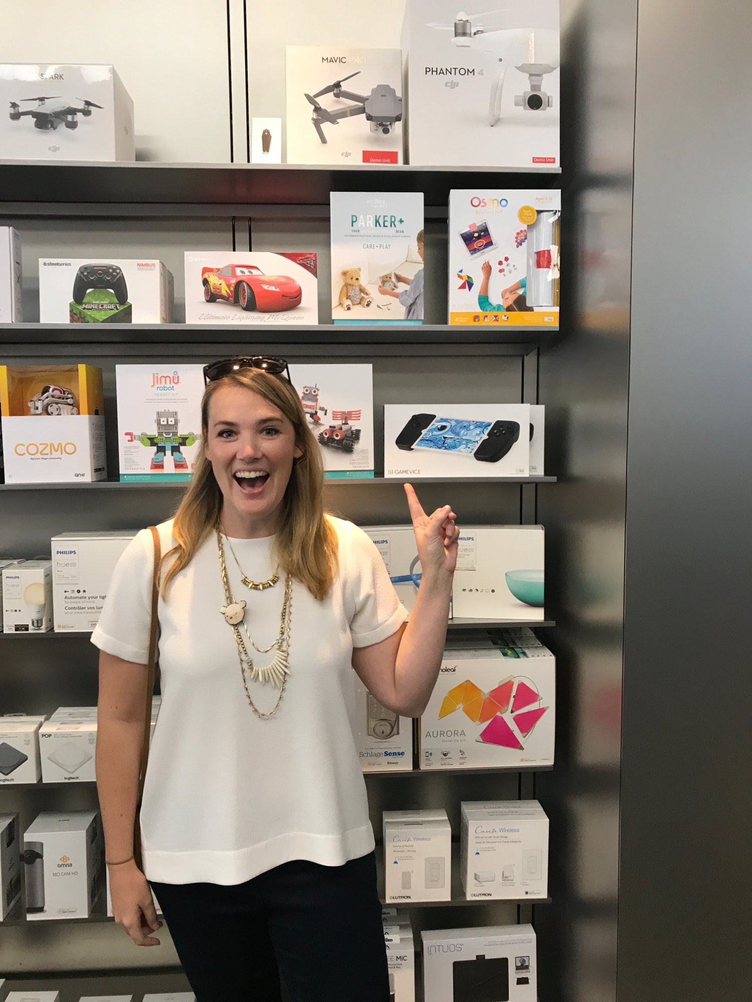 Rachel pointing at Parker on the shelf at Apple Store